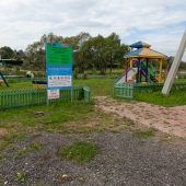 Детская площадка и информационный стенд поселка